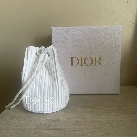 Dior Handbags - Authentic Dior White Drawstring Bag. New. Comes with box.